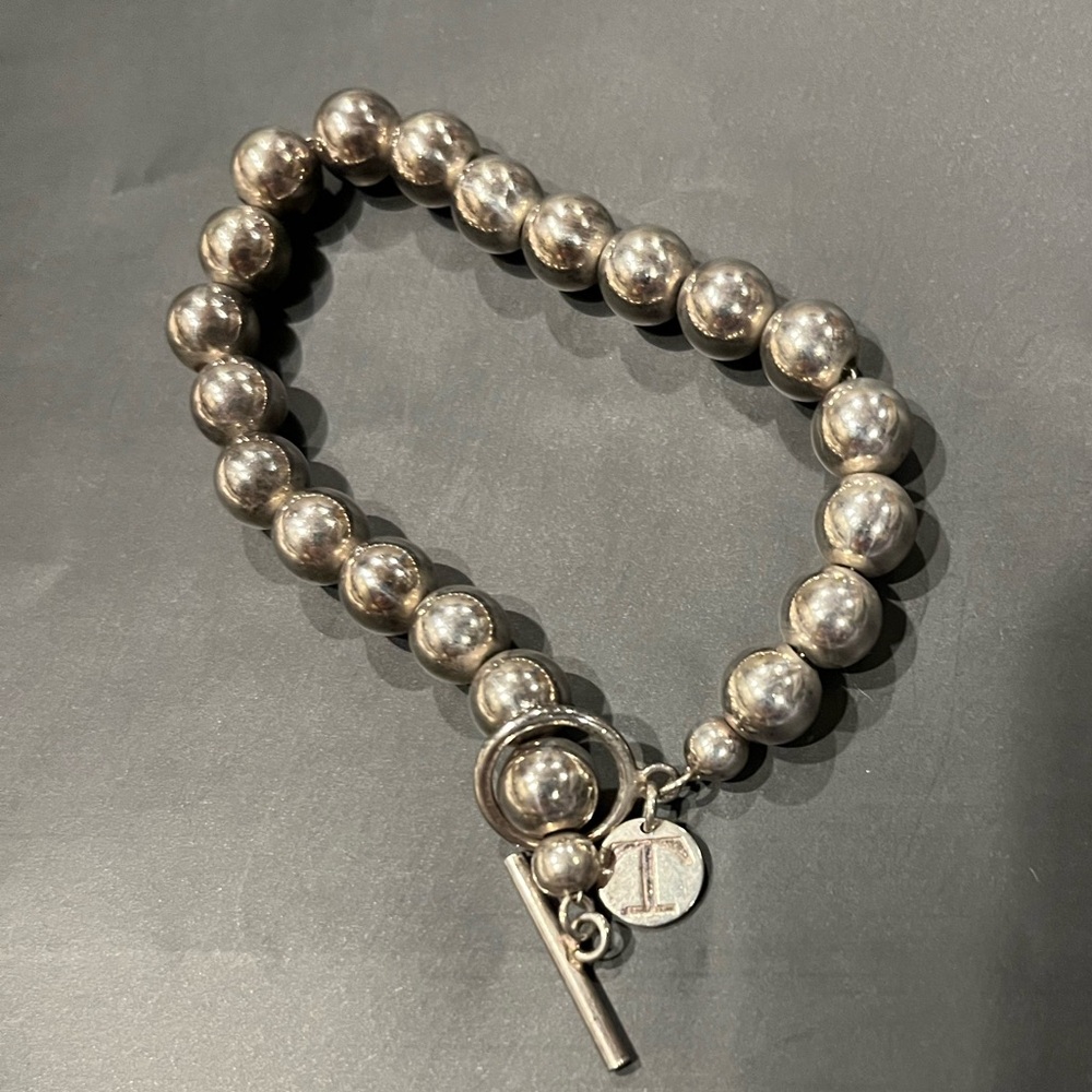 Elegant Sterling Silver Beaded Bracelet with matching studs